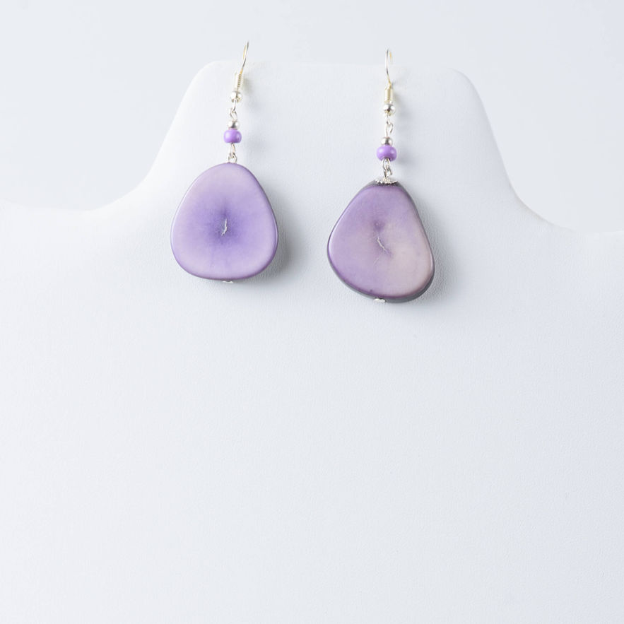 Purple tagua earrings on white display. lightweight, handcrafted, organic, natural fashion jewelry made from naturally sourced materials
