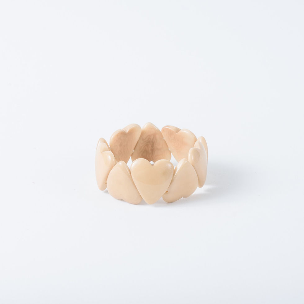 Handmade natural tagua heart bracelet in Beige featuring 8 to 10 polished heart beads