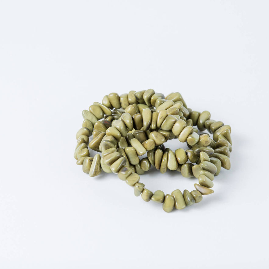 Green corn chip shaped tagua braceletts. Light weight, organic, practical.