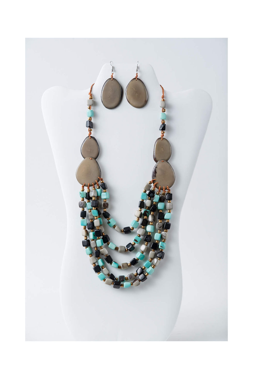 Necklace and earring set on display; Nova Single-Color Tagua Bead Earrings – Handmade Triangle Earrings; TaguArtsy