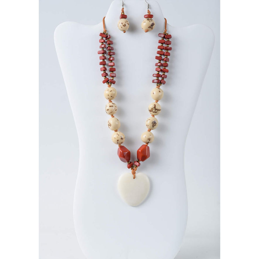 Red and cream beaded necklace with white heart tagua pendant and earrings.
