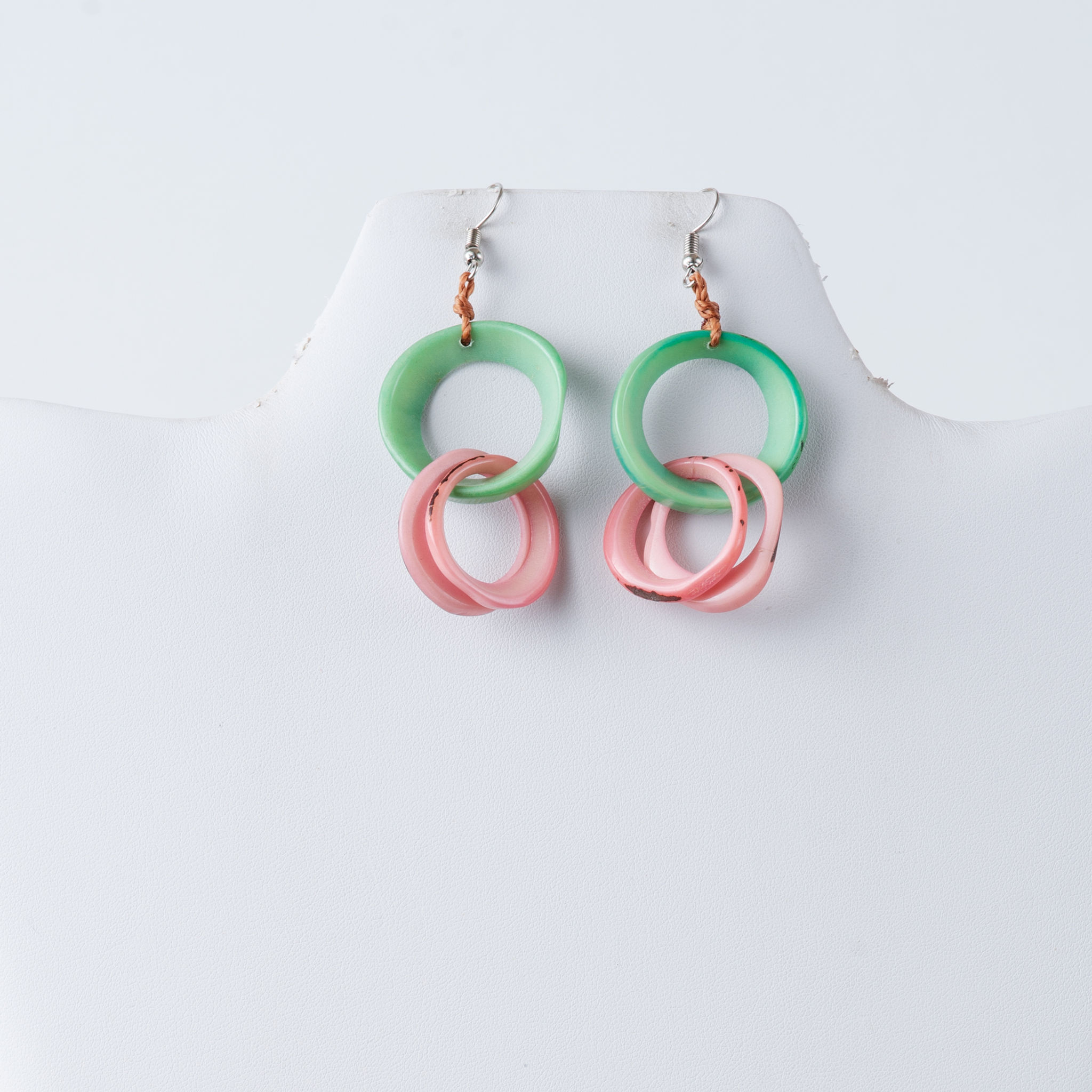 Green and pink hoop earrings on white background, tagua bead earrings. TaguArtsy