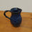 Thumbnail: Miniature, deep blue pottery jug