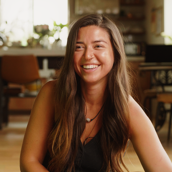 young woman sits down for a chistian testimony interview