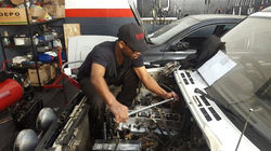Our Smallest mechanic working ont he biggest car