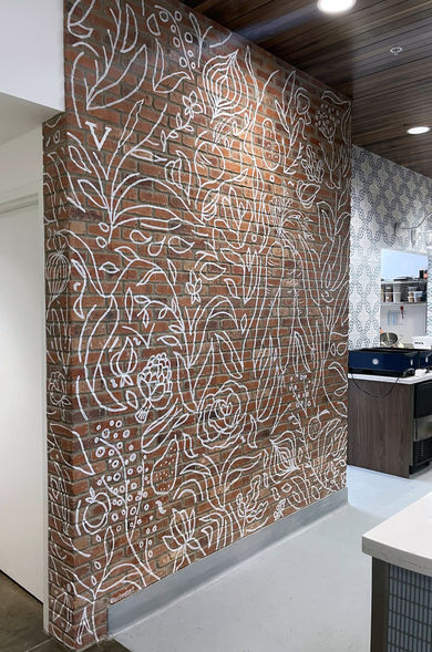 Line work mural on brick with plans and vegetables for the interior of a restaurant