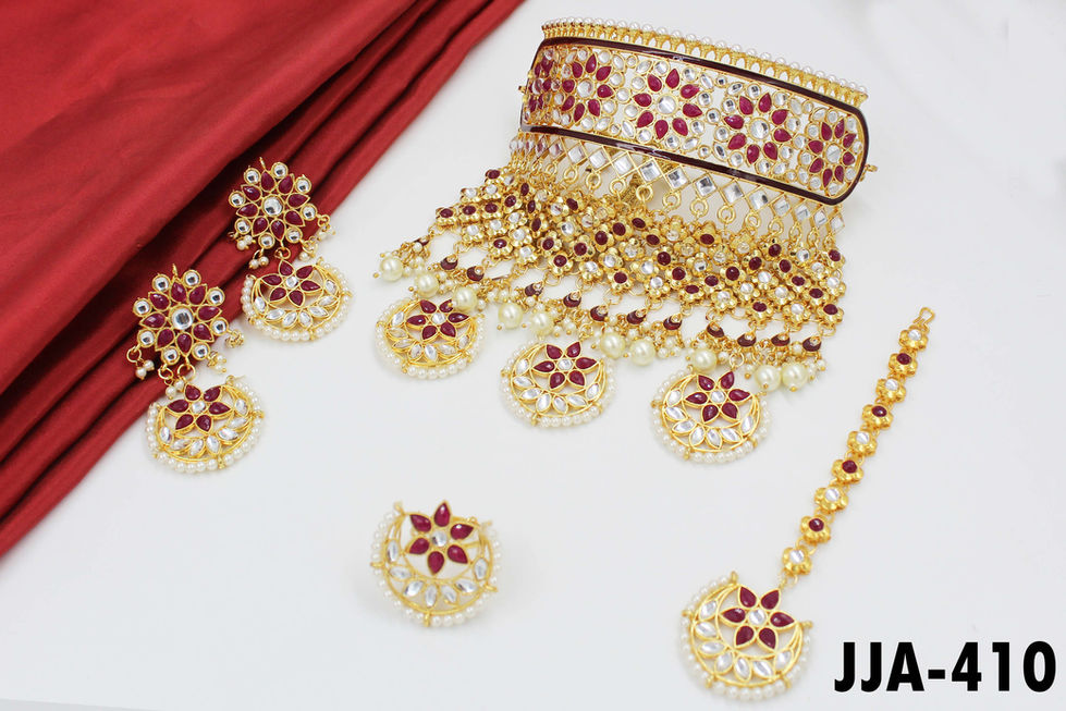Rajputi Imitation AAD Necklace Set with matching earrings, tikka, and finger ring, showcasing Kundan and traditional Mina work.