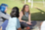 Jenna laughing sitting in a group