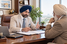 Sikh Executives Discussing Office Plans.png
