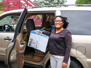 Tayia receives an air conditioner and two fans to help keep her home cool.