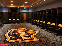 Houston Dynamo branded seats arranged in the locker room
