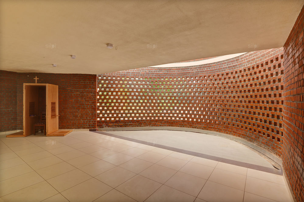 Exposed Brick Walls Create a Distinct Architectural Expression for this