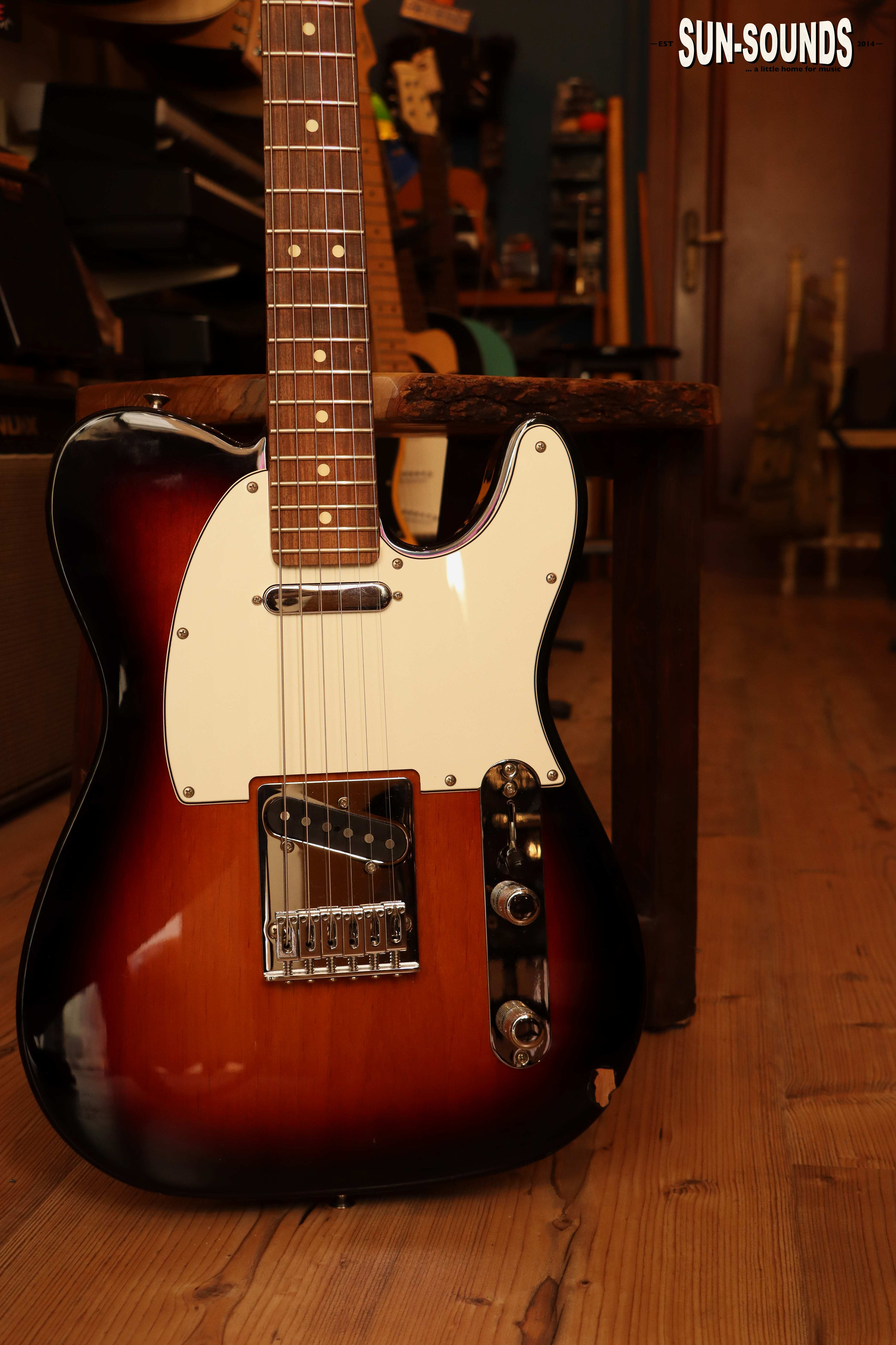 Fender Player Telecaster in 3-Color Sunburst leaning on a wooden stool at Sun-Sounds, Sliema