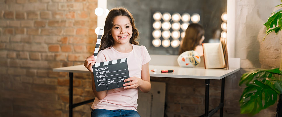 happy-girl-sitting-makeup-room-holding-clapper-board.jpg