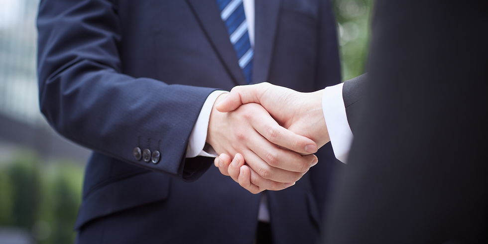 Men in suits shaking hands