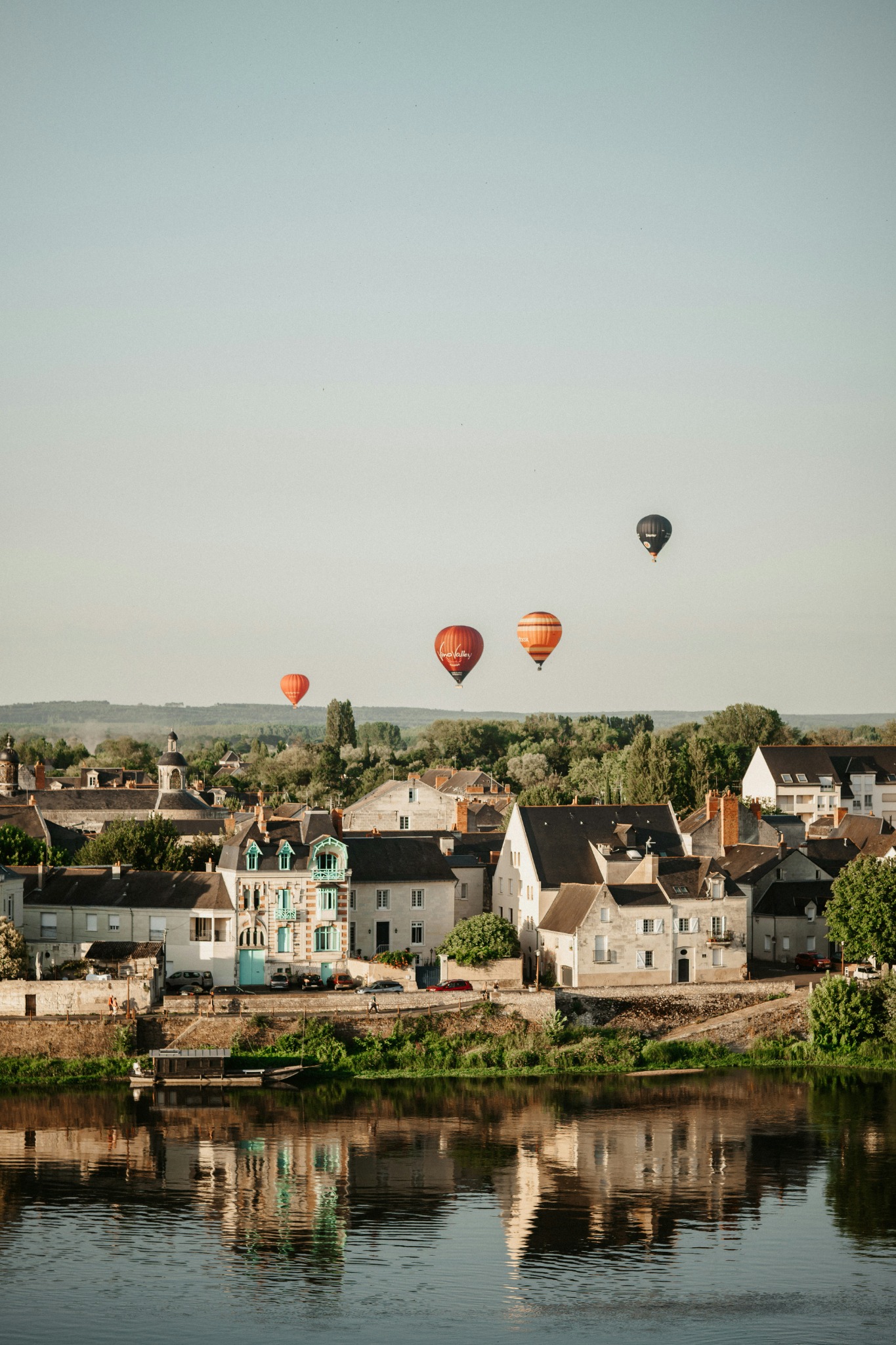 Hot air balloons floating over the Loire Valley