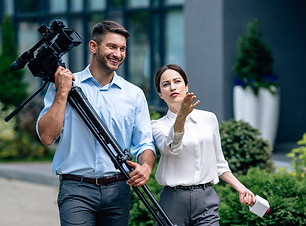 attractive-journalist-holding-microphone