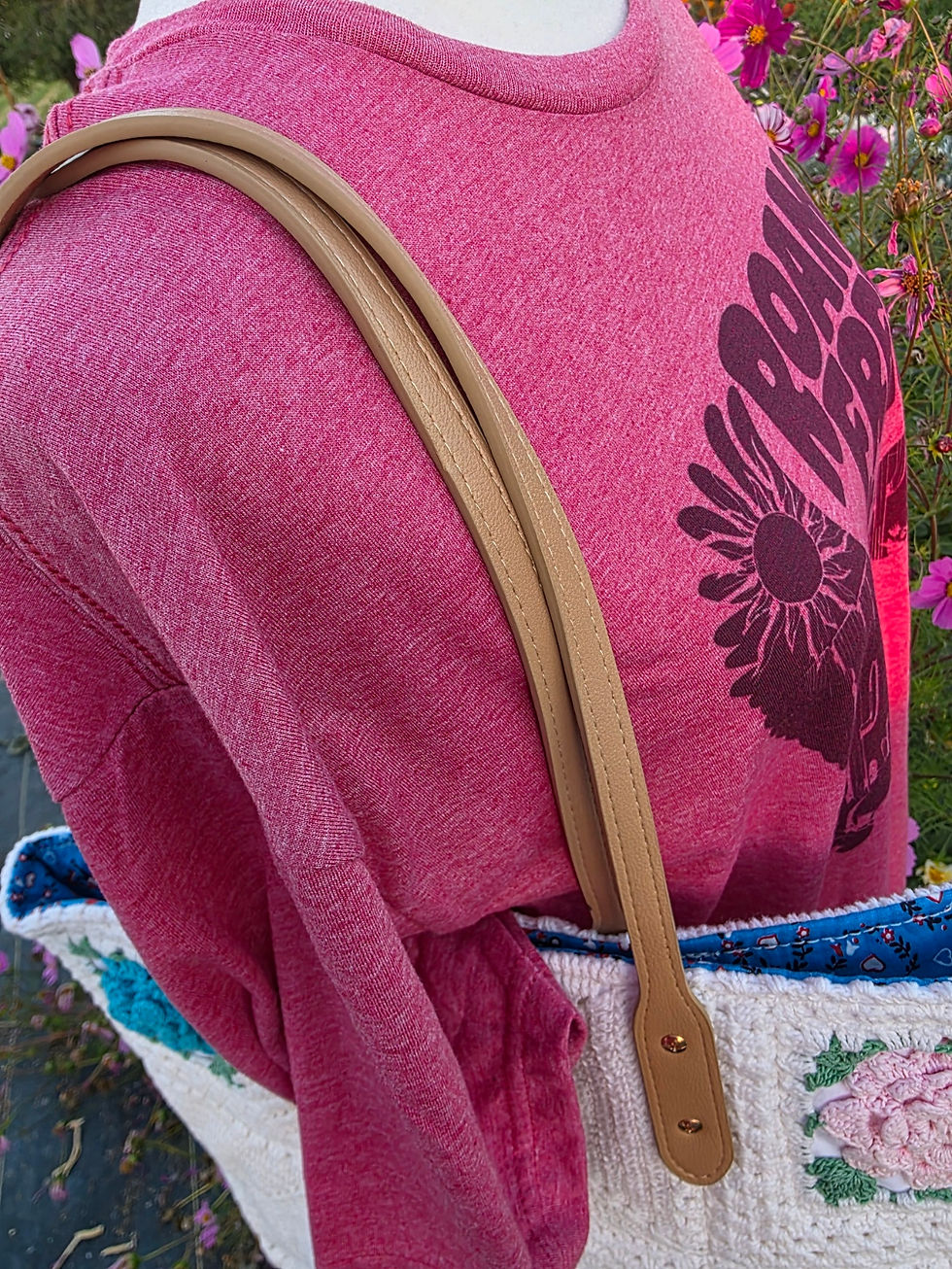 Straps on a handmade tote bags made from a vintage blanket
