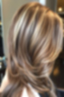 Woman with layered blonde and brown hair, beauty services, Inspirations Beauty Specialists