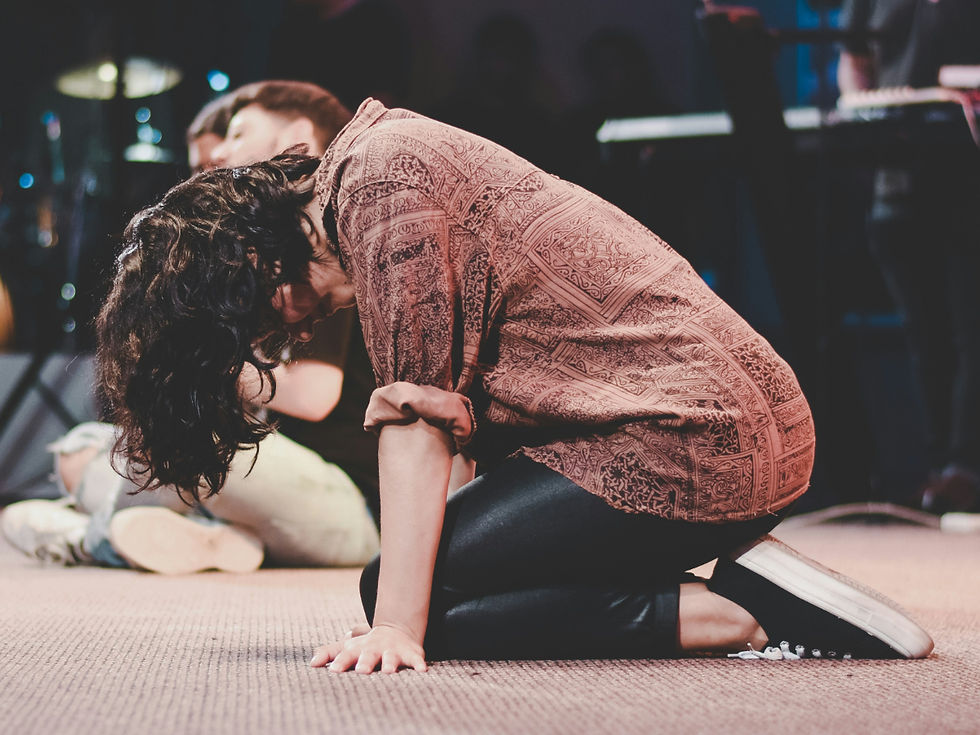 women praying on knees