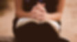 Hands praying and Bible