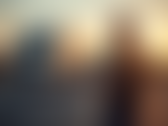 fleet manager reviewing data on a tablet with trucks in the background