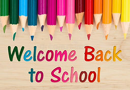 welcome-back-to-school-text-colorful-pencil-crayons-wood-desk-welcome-back-to-school-messa
