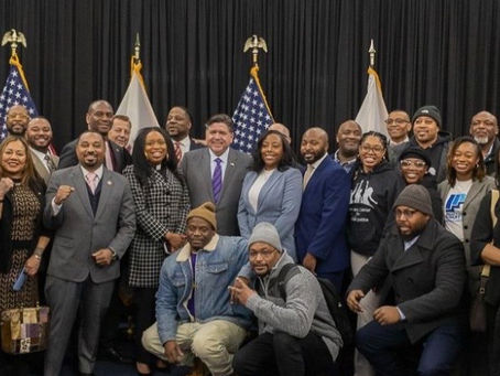 Members of the Clean Slate Illinois Coalition pose with legislative champions after the bill was signed by Governor Pritzker.