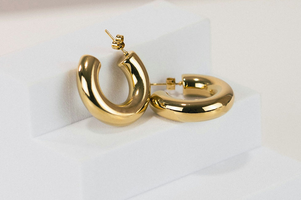 A pair of gold hoop earrings