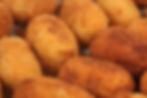 Close-up of perfectly fried croquetas, a classic Spanish street food favorite, crispy on the outside and creamy inside