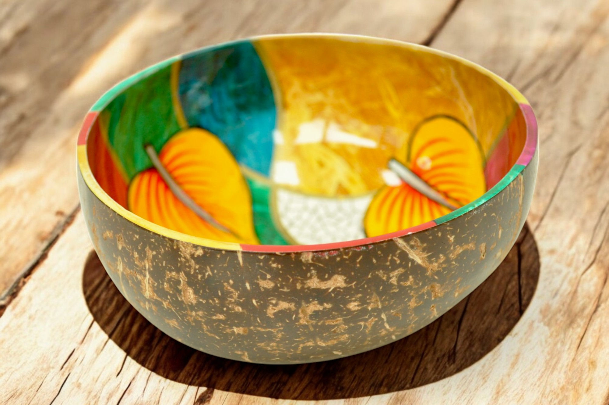 hand drawn coconut decorative bowl with abstract symbol leaf green yellow red orange blue