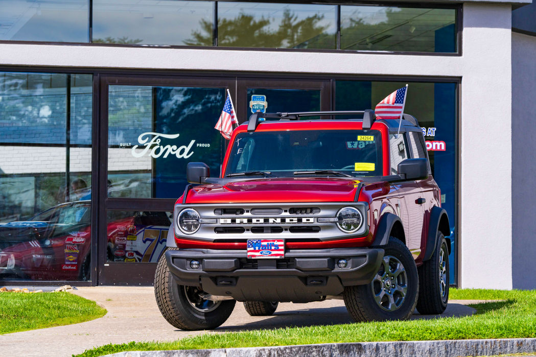A Ford Bronco in front of independent dealership taken during a custom photography shoot.