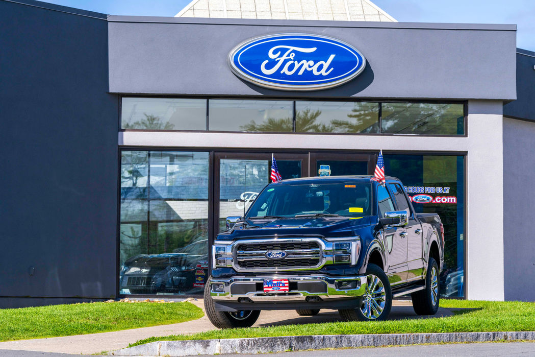 A Ford Truck in front of independent dealership taken during a custom photography shoot.