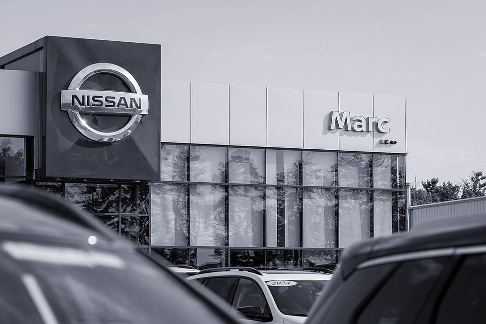 Black and white photograph of Mark Motors dealership front.