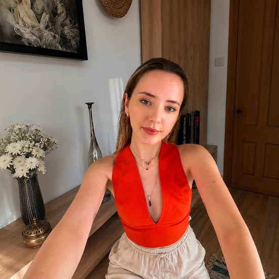 Woman in red top wearing Ruby Gemstone Cascade Earrings