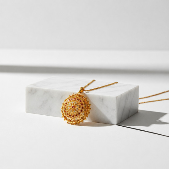 Yantra necklace on a marble pedestal
