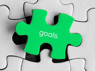 Green jigsaw piece with word 'goals' on it