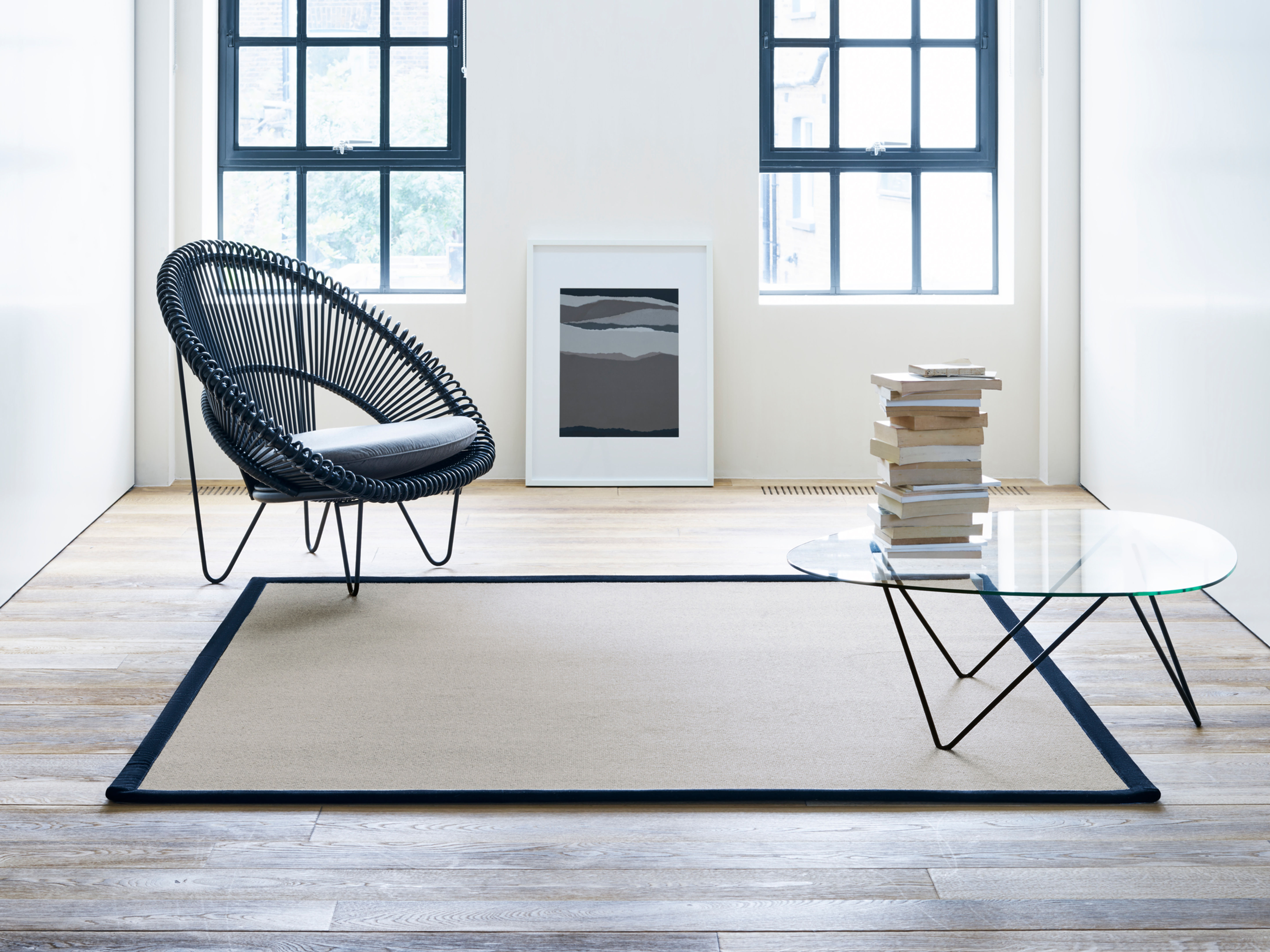 Wool stair runner with a black border in a modern living room.