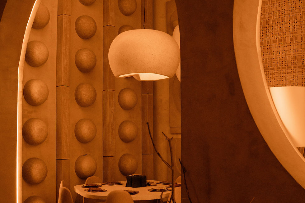 a dimly lit room with a circular mirror