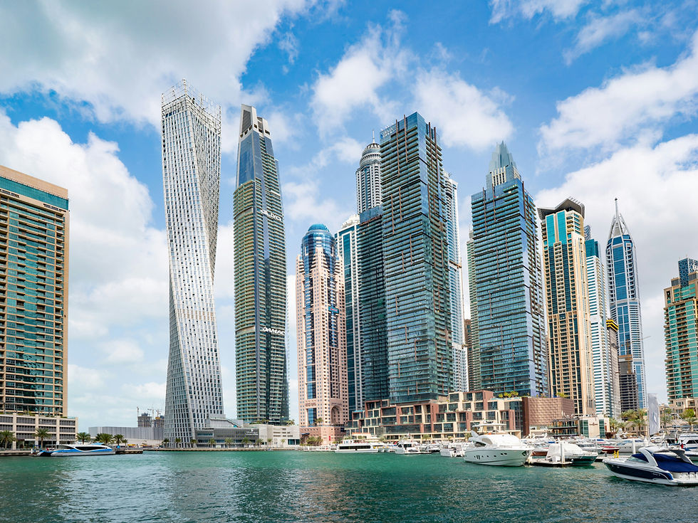 Dubai Marina waterfront by day with residential towers and yachts