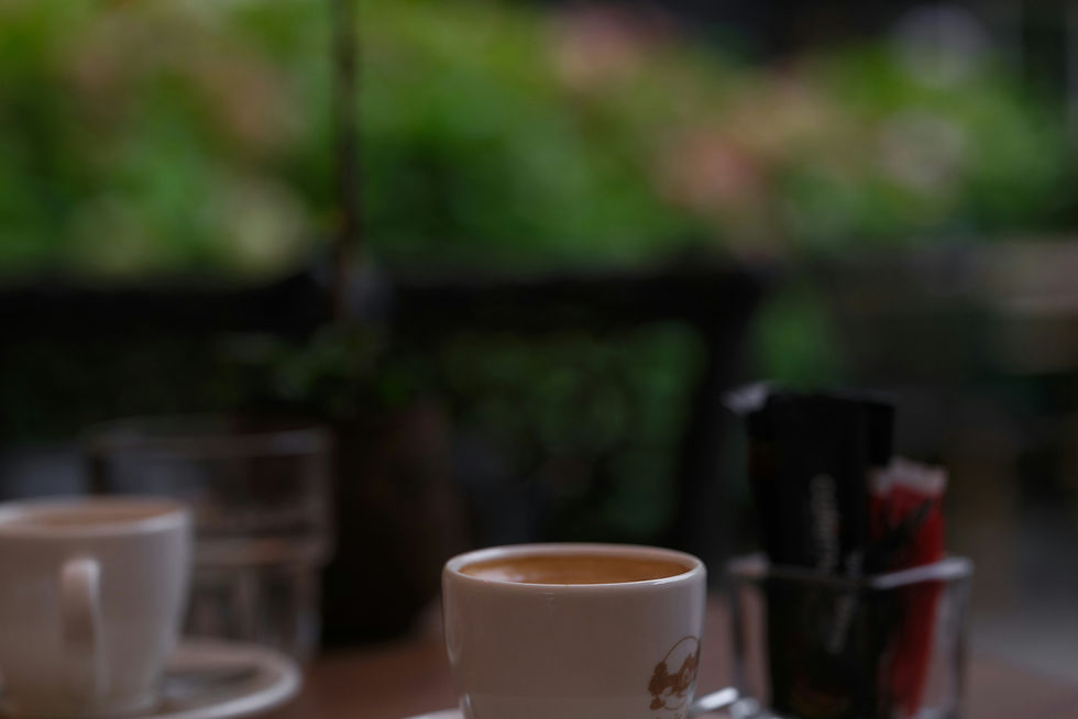 cup of coffee sugar and milk on a restaurant table