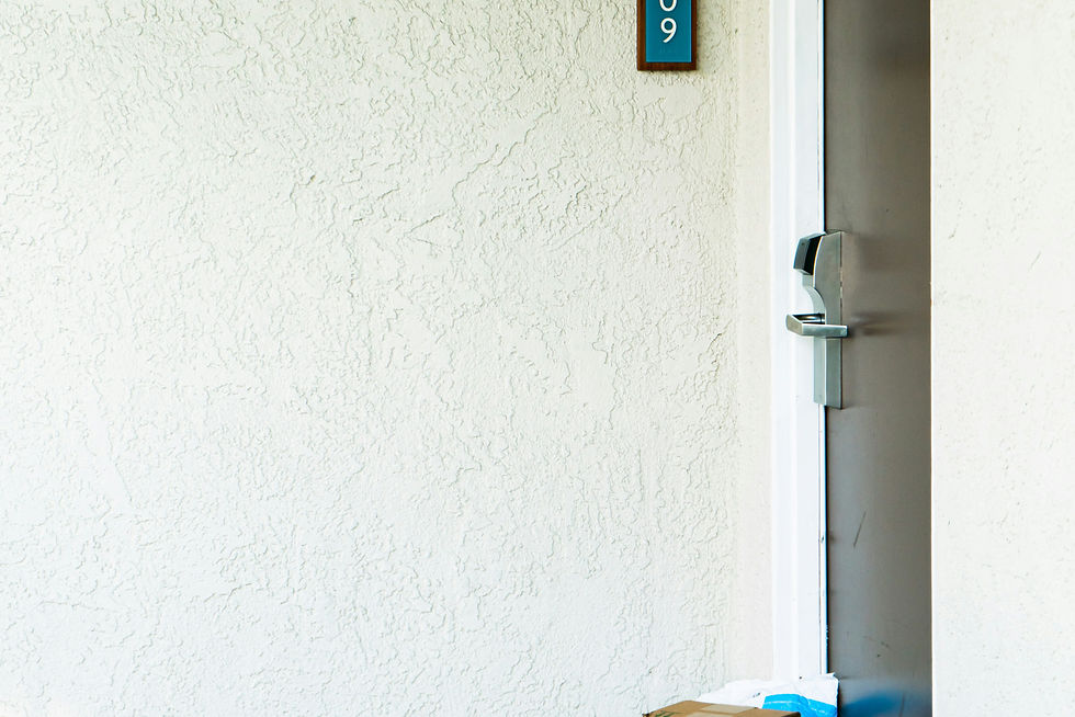 a cardboard box sitting in front of a door