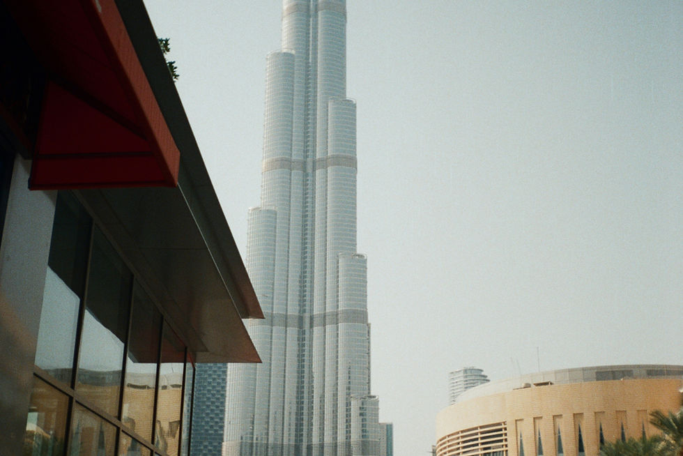 Burj khalifa skyscraper with a bus in foreground