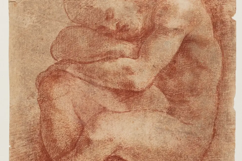 Seated man resting his head