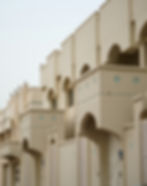 Masdar City's distinctive beige arched Islamic-inspired sustainable architecture in Abu Dhabi