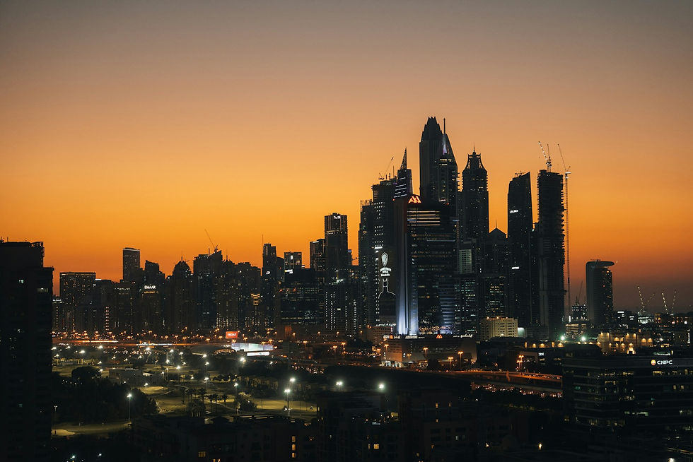 Dubai financial district skyscrapers at sunset along Sheikh Zayed Road