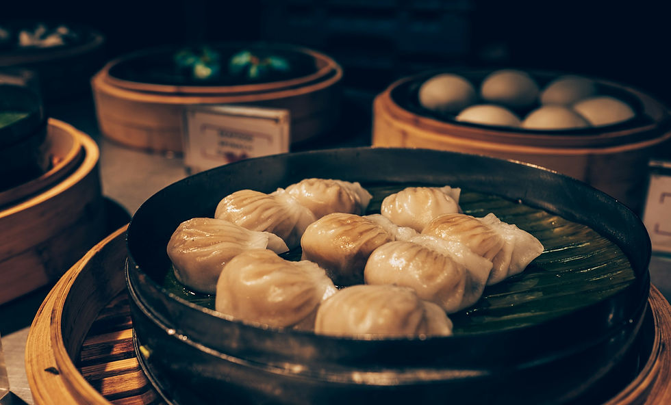 Steaming dumplings inside a bamboo steamer, close-up