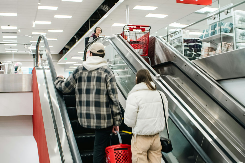 Two people ascending an escalator at Target in Seattle.