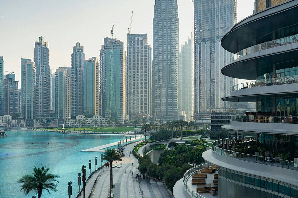 Dubai Marina and Downtown towers at dusk — off-plan sales drove AED 19.7 billion in April, the highest monthly off-plan 