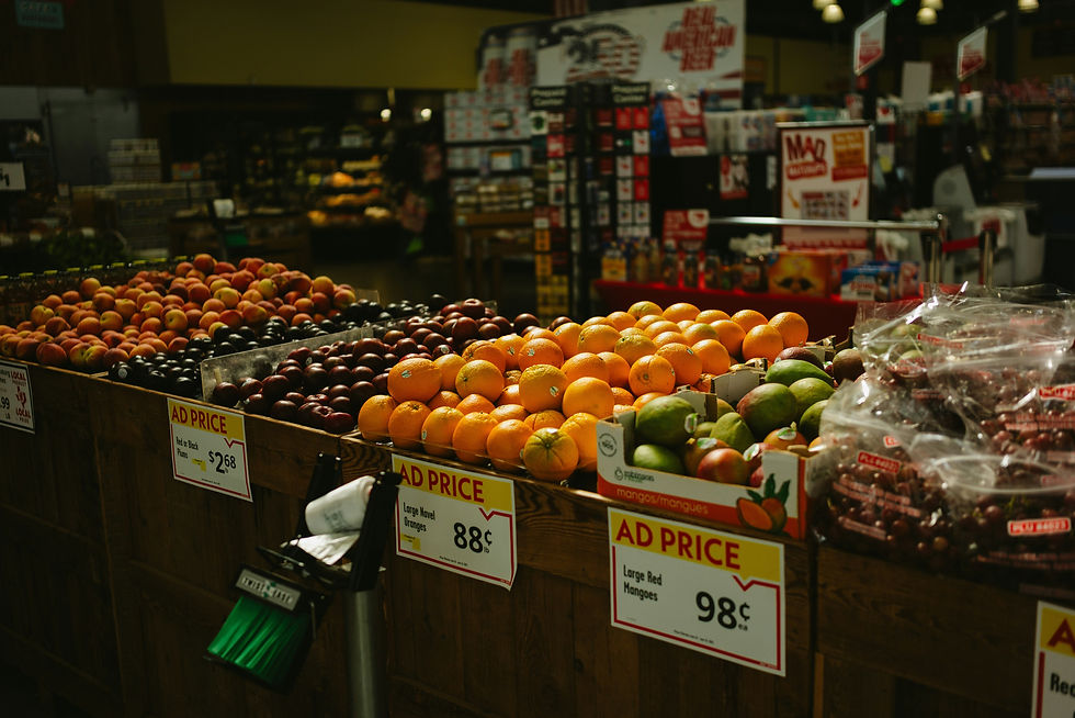 Various fresh fruits on display in a supermarket.